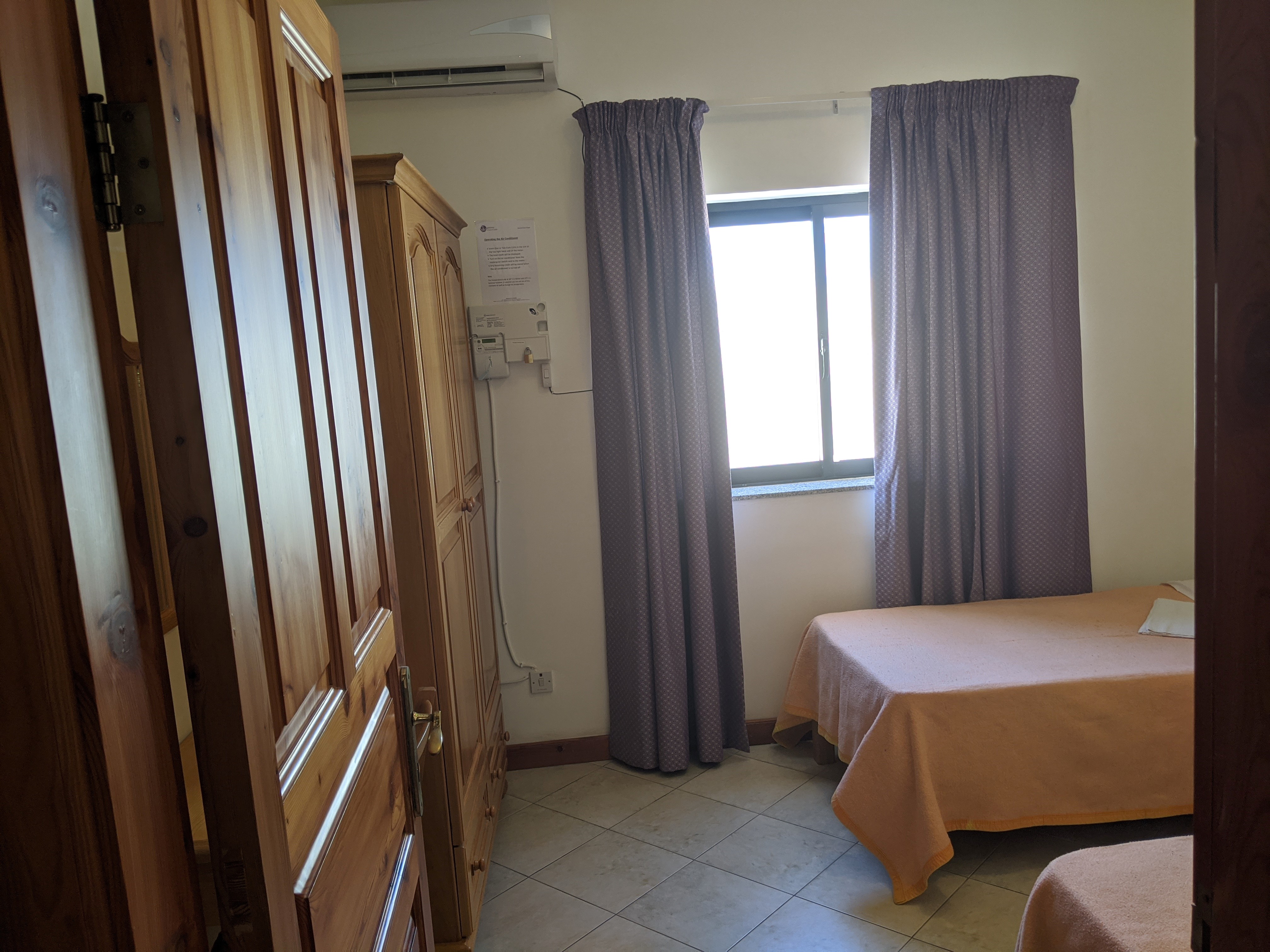 Study English in Malta - GSE Residence bedrooms next to school with windows and balconies